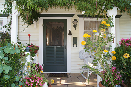 click to view larger image A lushly landscaped entrance to a Craftsman home